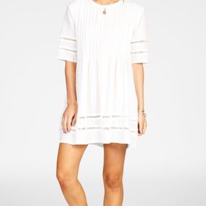 Knot Sisters white pleated dress with trim detail